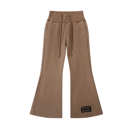 Brown pants with a visible house on a white background