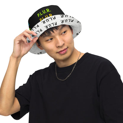 PLUR Rainbow Reversible Bucket Hat on a model