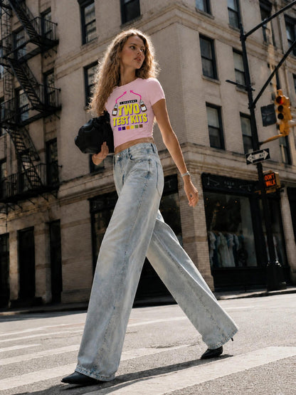 Two Test Kits Baby Tee in Pink on a model, full-length front view